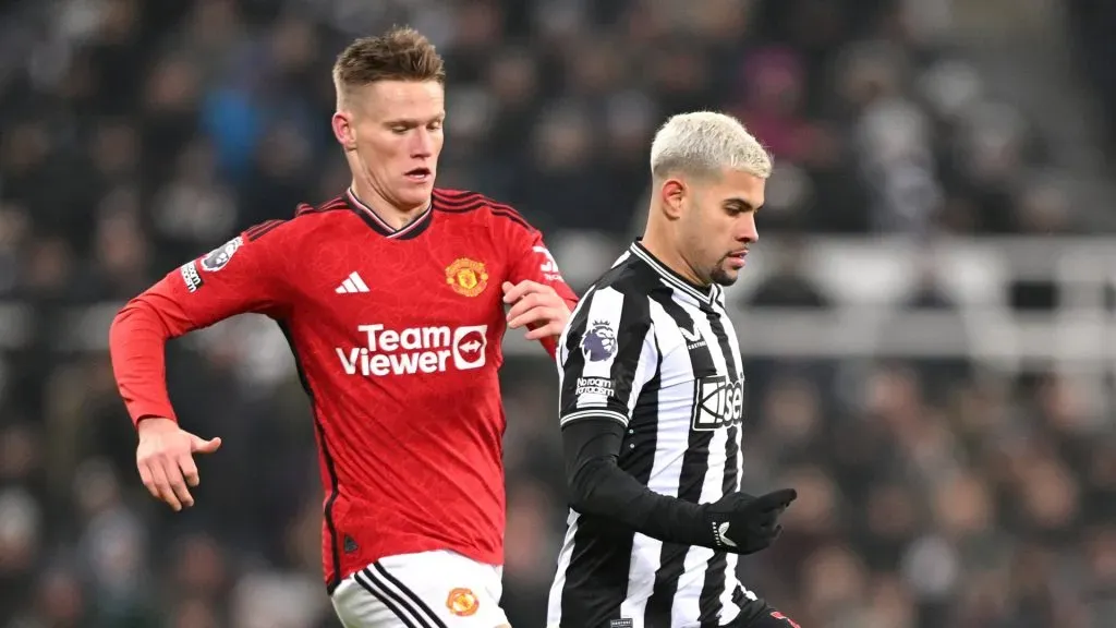 Newcastle United player Bruno Guimaraes is challenged by Scott McTominay during the Premier League match between Newcastle United and Manchester United at St. James Park on December 02, 2023 in Newcastle upon Tyne, England.