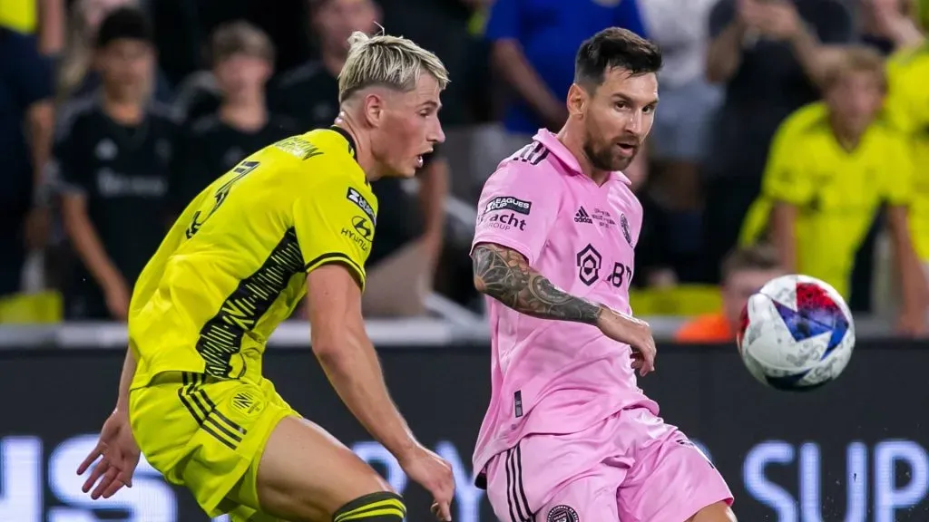 Inter Miami forward Lionel Messi (10) crosses the ball ahead of Nashville SC defender Lukas MacNaughton (3) during the Leagues Cup Final match between Nashville SC and Inter Miami CF on Saturday, August 19, 2023 at GEODIS Park in Nashville, TN