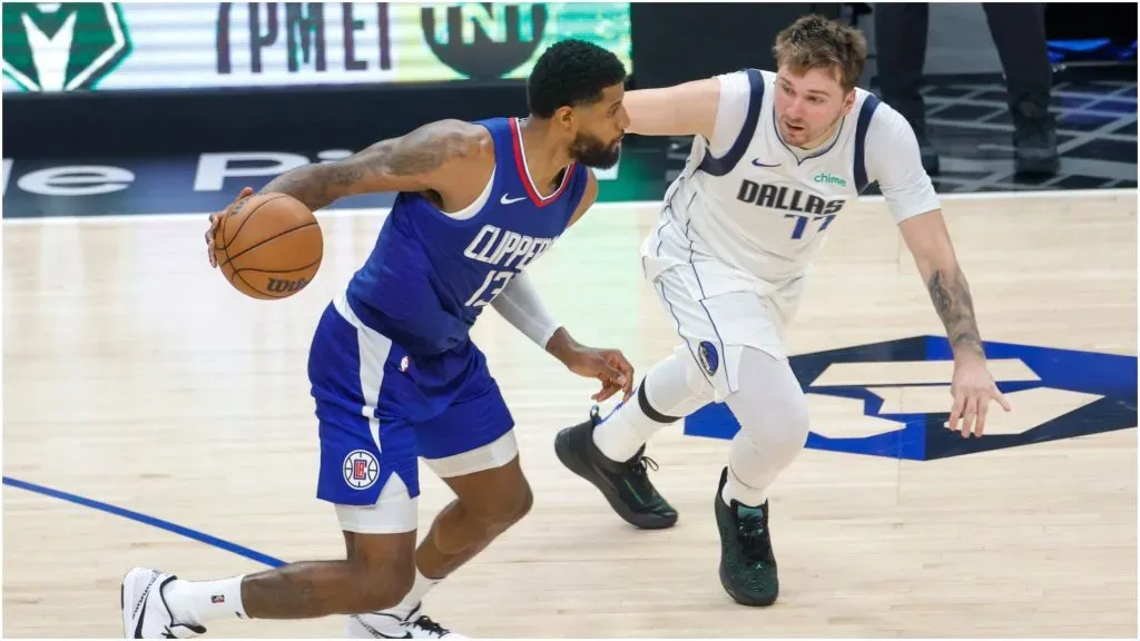 Los Angeles Clippers Paul George (L) is defended by Dallas Mavericks Luka Doncic – IMAGO / Xinhua