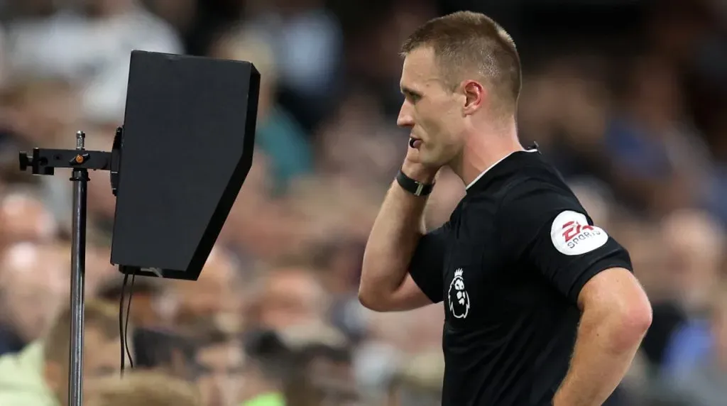 Premier League referee checks the VAR screen