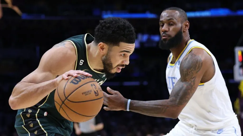 Jayson Tatum #0 of the Boston Celtics dribbles around LeBron James #6 of the Los Angeles Lakers during a 122-118 Celtics overtime win at Crypto.com Arena on December 13, 2022 in Los Angeles, California.