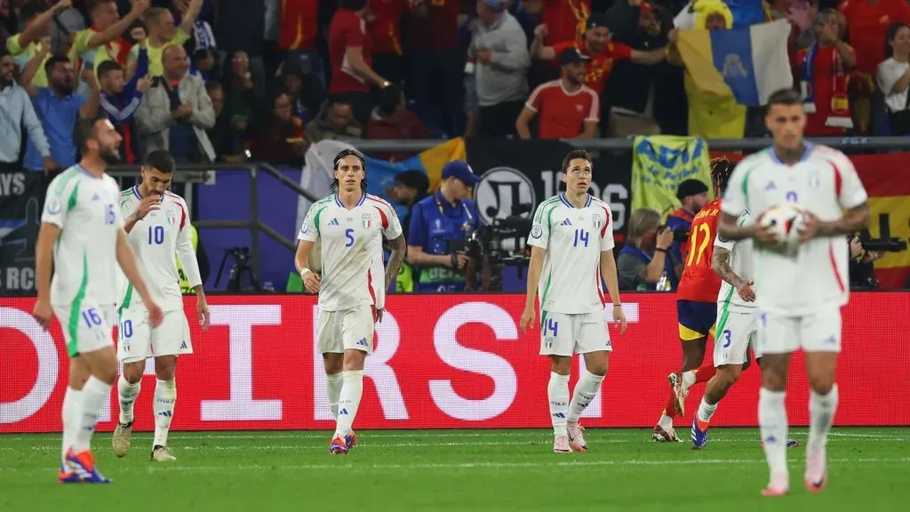 Riccardo Calafiori of Italy looks dejected with teammates after conceding an own goal, the first goal for Spain, during the UEFA EURO 2024. Photo by Lars Baron/Getty Images