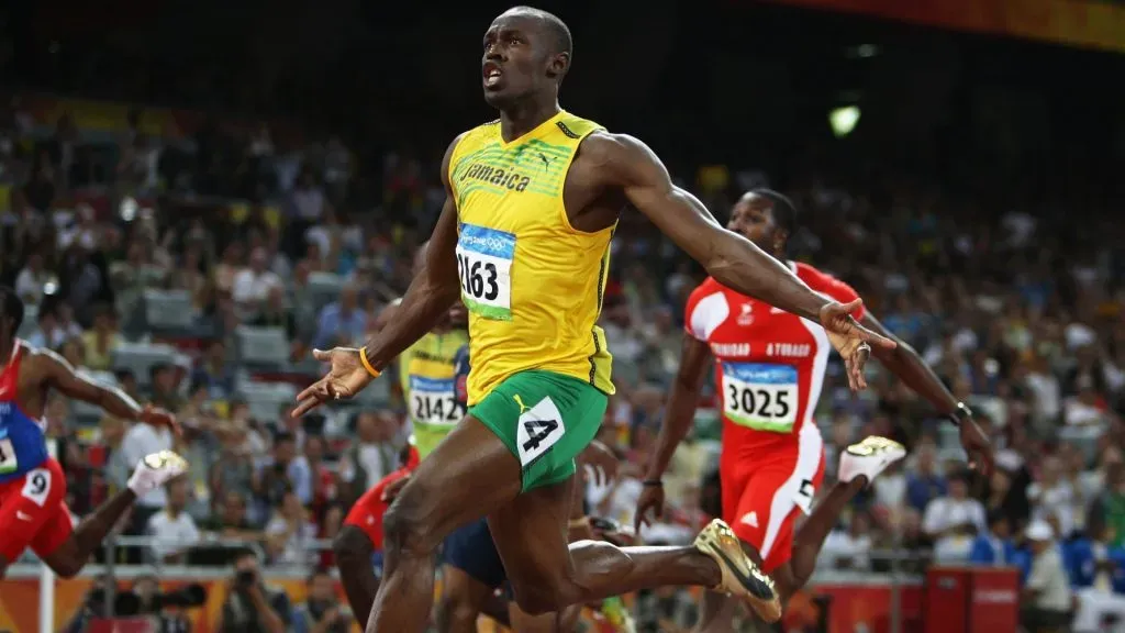 Usain Bolt of Jamaica celebrates as he crosses the line to win the Menās 100m Final at the National Stadium on Day 8 of the Beijing 2008 Olympic Games on August 16, 2008 in Beijing, China. Bolt clocked a new world record time of 9.69 seconds. (Photo by Mark Dadswell/Getty Images)