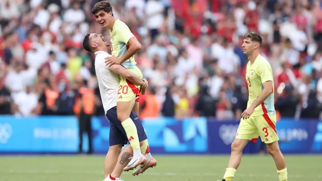 Juanlu Sanchez #20 of Team Spain celebrates with teammate victory after the Menās semifinal match between Morocco and Spain during the Olympic Games Paris 2024. Alex Livesey/Getty Images