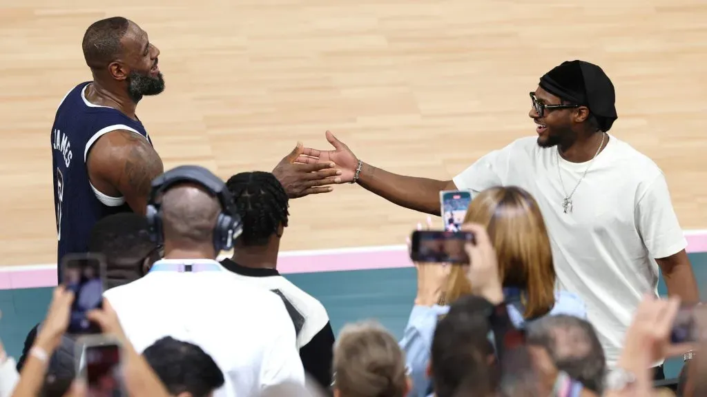 LeBron James #6 of Team United States high fives his son and NBA player Bronny James. Jamie Squire/Getty Images