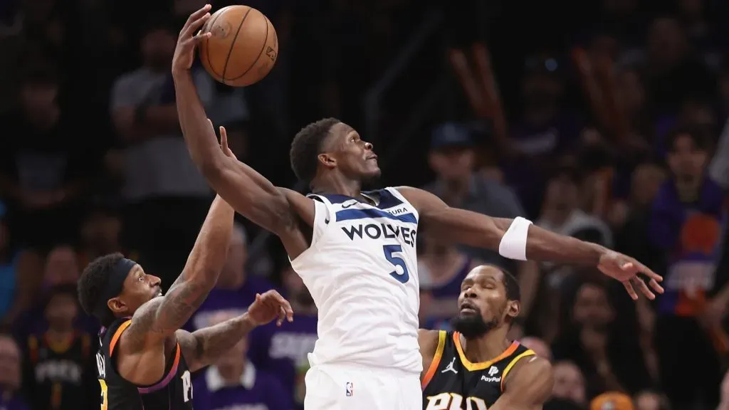 Anthony Edwards #5 of the Minnesota Timberwolves slam dunks the ball ahead of Bradley Beal #3 and Kevin Durant #35 of the Phoenix Suns. Christian Petersen/Getty Images