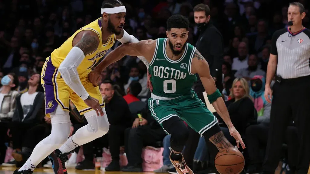 Jayson Tatum #0 of the Boston Celtics drives to the basket past Carmelo Anthony #7 of the Los Angeles Lakers. Harry How/Getty Images