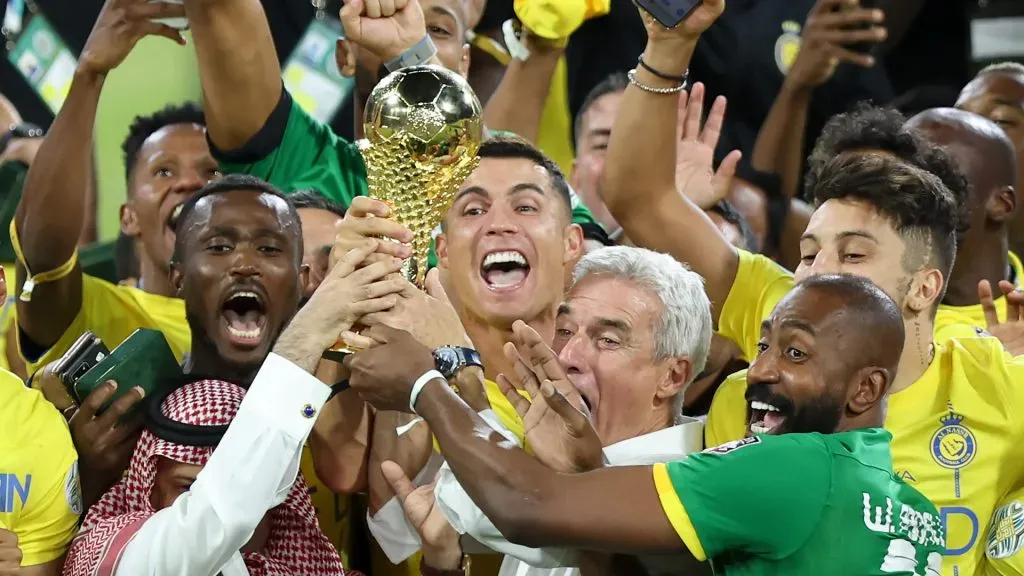 Cristiano Ronaldo of Al Nassr lifts the Arab Club Champions Cup trophy with teammates after the teamās victory in the Arab Club Champions Cup Final between Al Hilal and Al Nassr. Yasser Bakhsh/Getty Images