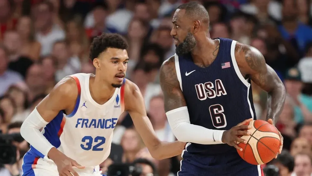 Victor Wembanyama #32 of Team France defends Lebron James #6 of Team United States during the Men’s Gold Medal game between Team France and Team United States on day fifteen of the Olympic Games Paris 2024 at Bercy Arena on August 10, 2024 in Paris, France. (Photo by Michael Reaves/Getty Images)