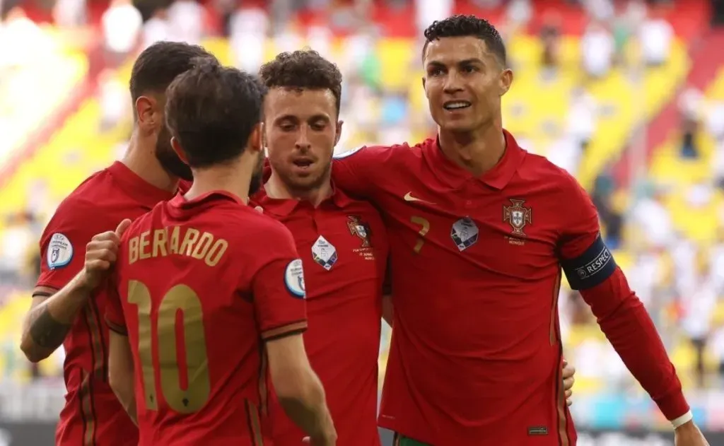 Cristiano Ronaldo of Portugal celebrates with Diogo Jota and Bernardo Silva.