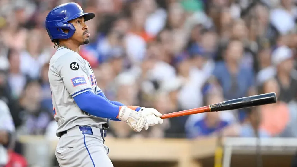 Francisco Lindor #12 of the New York Mets hits a grand slam during the fourth inning of a baseball game against the San Diego Padres. (Photo by Denis Poroy/Getty Images)