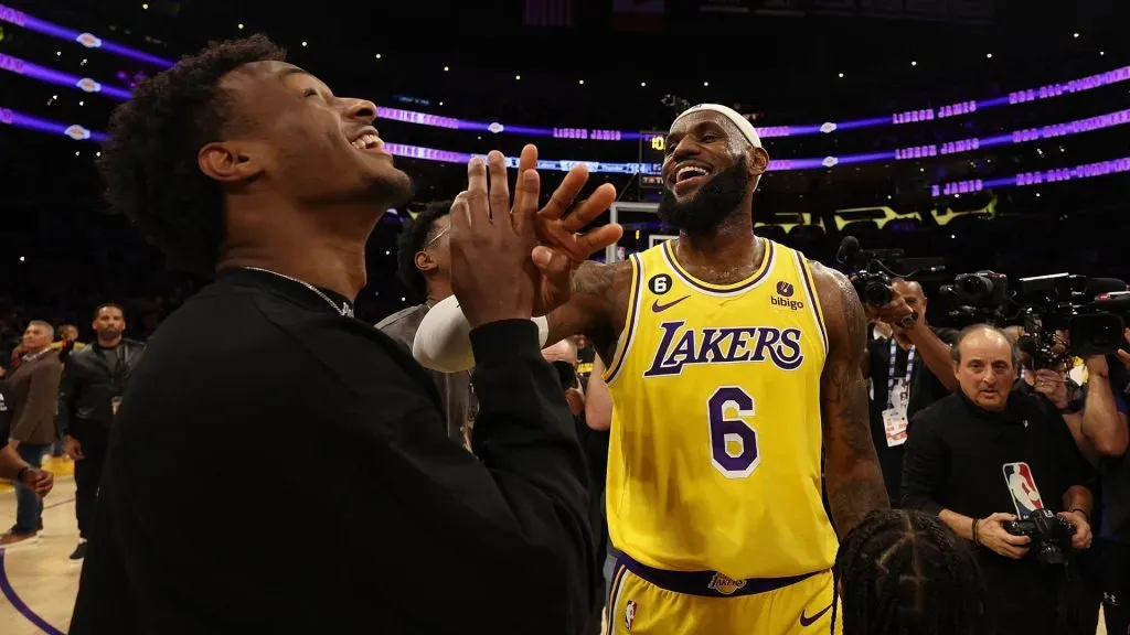 LeBron James #6 of the Los Angeles Lakers reacts with Bronny James after scoring to pass Kareem Abdul-Jabbar to become the NBA’s all-time leading scorer, surpassing Abdul-Jabbar’s career total of 38,387 points against the Oklahoma City Thunder. (Photo by Harry How/Getty Images)