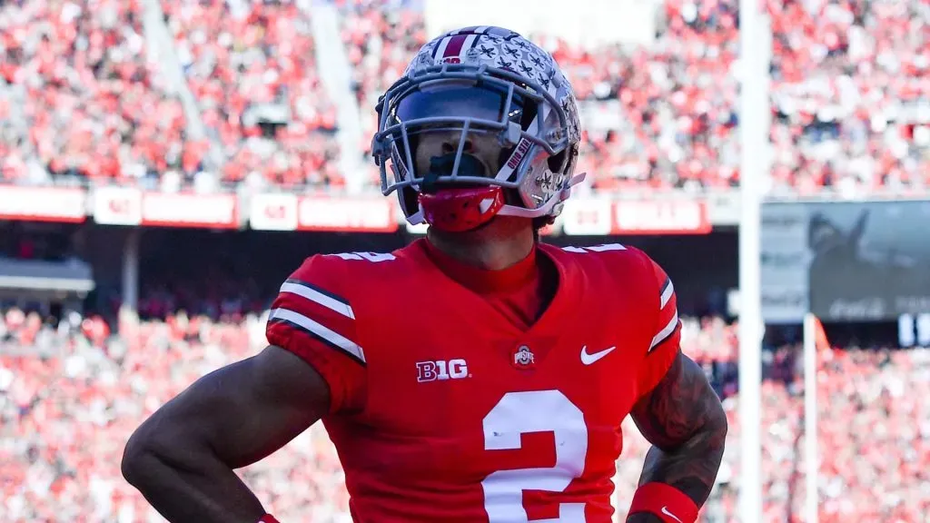 Emeka Egbuka #2 of the Ohio State Buckeyes poses after scoring a touchdown during the first quarter of a game against the Michigan Wolverines at Ohio Stadium on November 26, 2022 in Columbus, Ohio.