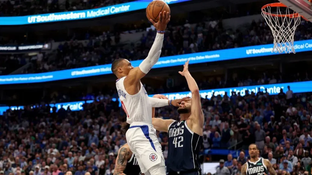 Russell Westbrook #0 of the Los Angeles Clippers goes up for a lay up while defended by Maxi Kleber #42 of the Dallas Mavericks in the second half of game four of the Western Conference First Round Playoffs at American Airlines Center on April 28, 2024 in Dallas, Texas. (Photo by Tim Warner/Getty Images)