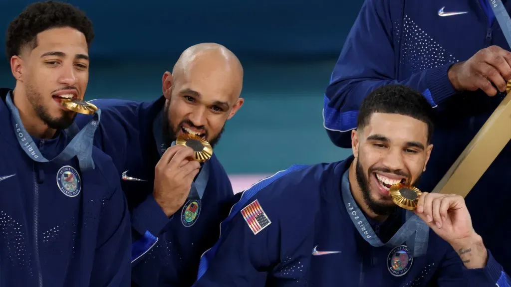 Gold medalists Tyrese Haliburton, Derrick White, and Jayson Tatum of Team United States pose with their medals. Jamie Squire/Getty Images