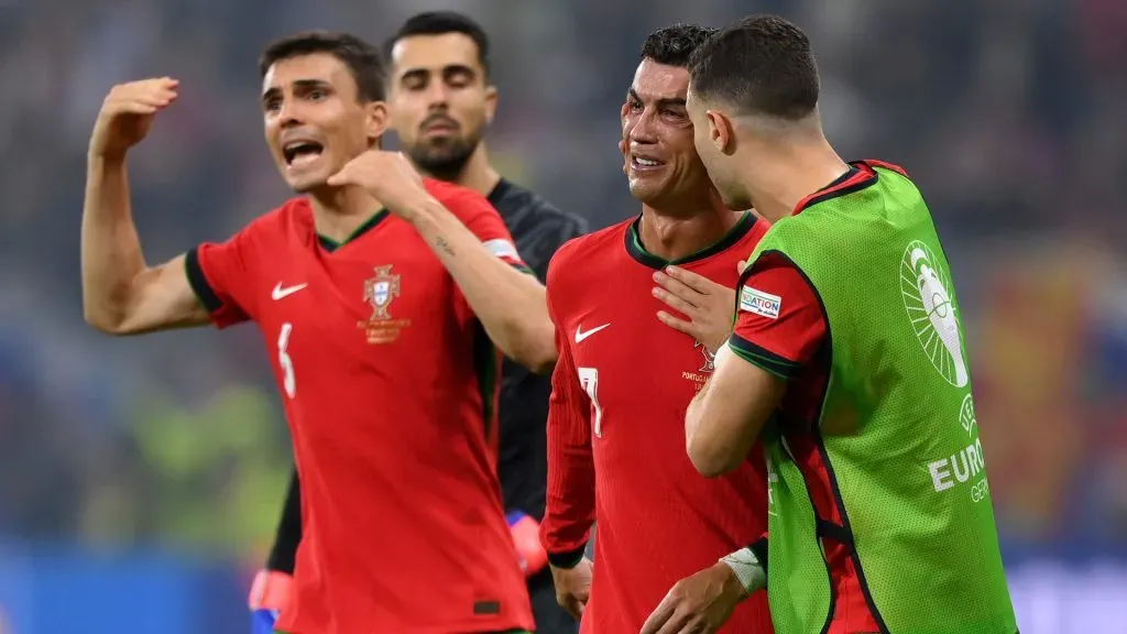 Cristiano Ronaldo of Portugal is consoled by Diogo Dalot of Portugal after missing a penalty during the UEFA EURO 2024 round of 16 match between Portugal and Slovenia. Justin Setterfield/Getty Images