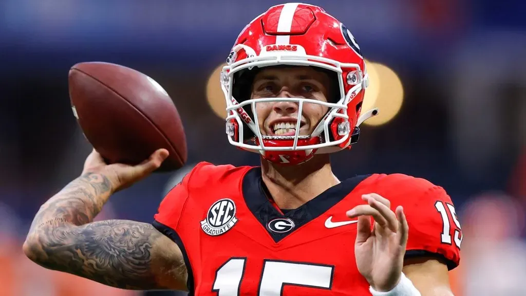 Carson Beck #15 of the Georgia Bulldogs warms up prior to the game against the Clemson Tigers in the Aflac Kickoff Game at Mercedes-Benz Stadium on August 31, 2024 in Atlanta, Georgia.