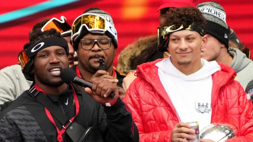 Nick Bolton #32 of the Kansas City Chiefs and Patrick Mahomes #15 of the Kansas City Chiefs celebrate on stage during the Kansas City Chiefs Super Bowl LVII victory parade on February 15, 2023 in Kansas City, Missouri.