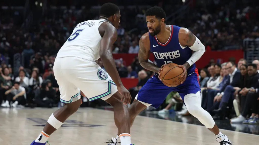 Paul George #13 of the LA Clippers is guarded by Anthony Edwards #5 of the Minnesota Timberwolves during a 118-100 Timberwolves win. Harry How/Getty Images