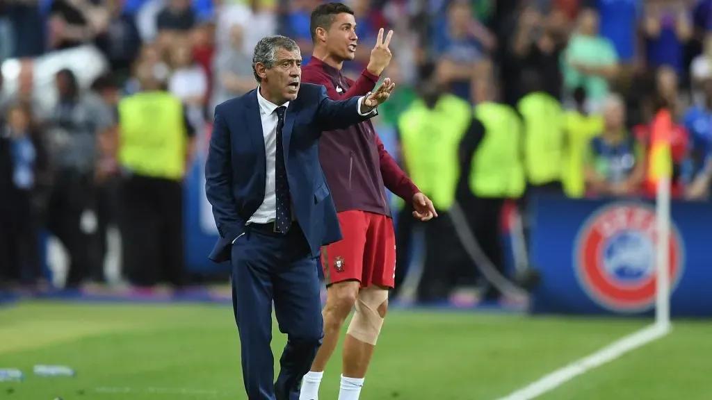 Cristiano Ronaldo and manager Fernando Santos gestures on the touchline during the UEFA EURO 2016 Final match. Laurence Griffiths/Getty Images