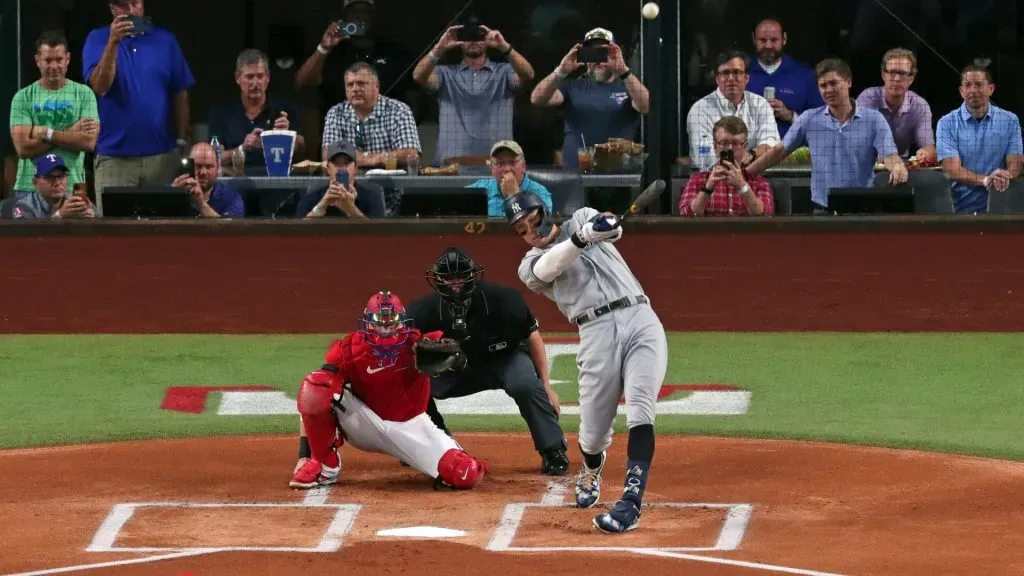 Aaron Judge #99 of the New York Yankees hits his 62nd home run of the season against the Texas Rangers during the first inning in game two of a double header at Globe Life Field. (Photo by Ron Jenkins/Getty Images)