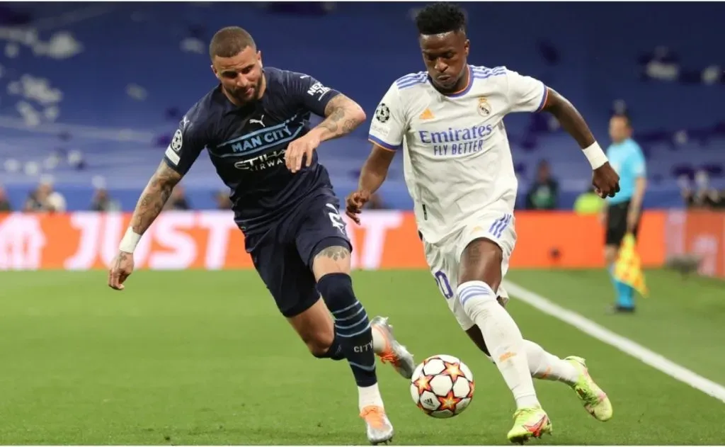 Vinicius Junior (R) of Real Madrid CF competes for the ball with Kyle Walker (L) of Manchester City FC