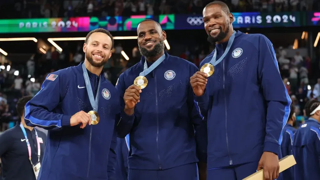 Stephen Curry, LeBron James, and Kevin Durant of Team United States pose for a photo during the Menâs basketball medal ceremony on day fifteen of the Olympic Games Paris 2024 at Bercy Arena on August 10, 2024 in Paris, France. (Photo by Gregory Shamus/Getty Images)