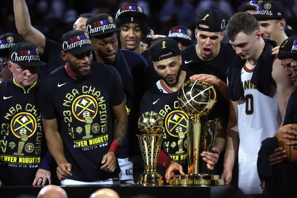 The Denver Nuggets celebrate with the Larry OāBrien Championship Trophy. Matthew Stockman/Getty Images