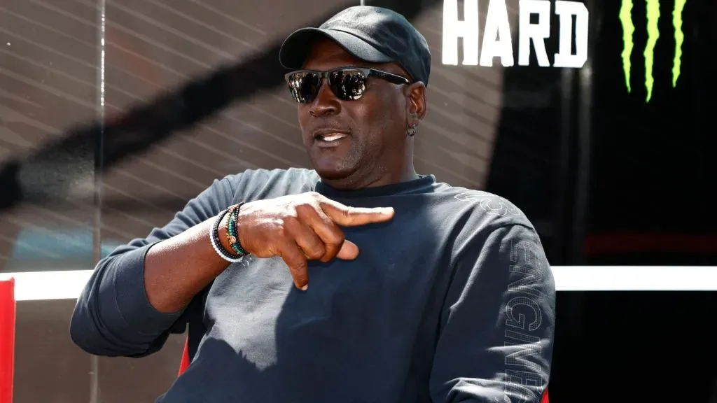 23xi co-owner Michael Jordan talks with members of his team prior to the running of the NASCAR, Motorsport, USA Cup Series Quaker State 400. IMAGO / Icon Sportswire.