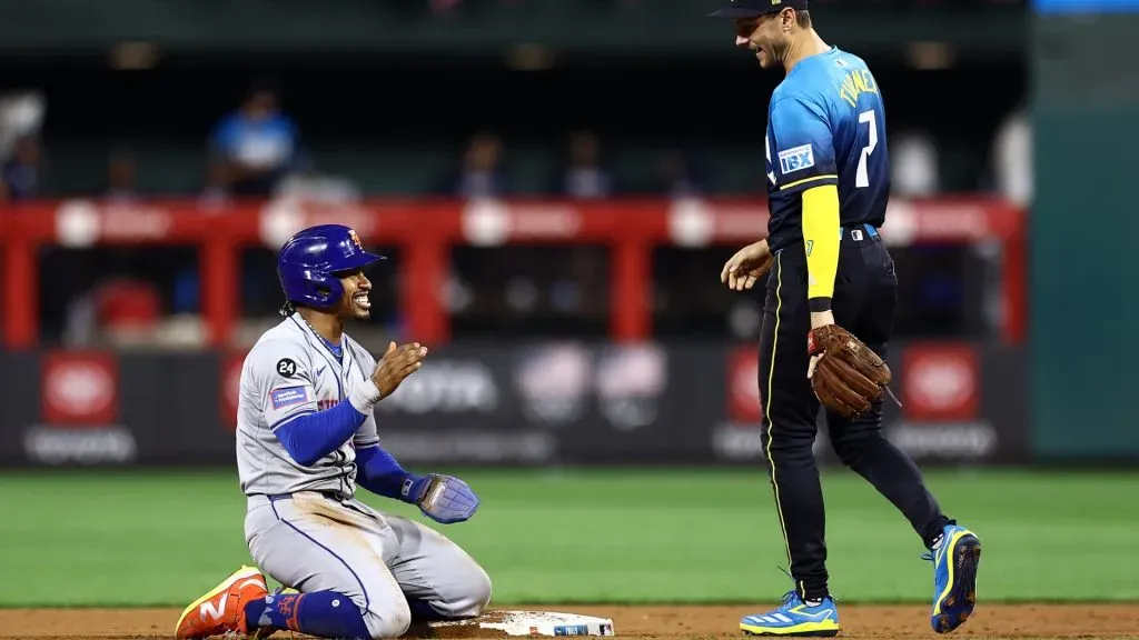 Francisco Lindor #12 of the New York Mets and Trea Turner #7 of the Philadelphia Phillies speak during the fifth inning at Citizens Bank Park on September 13, 2024 in Philadelphia, Pennsylvania. (Photo by Tim Nwachukwu/Getty Images)