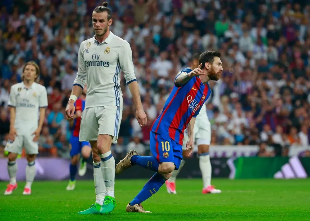 Lionel Messi of Barcelona celebrates as he scores their first and equalising goal as Gareth Bale of Real Madrid looks dejected. Gonzalo Arroyo Moreno/Getty Images