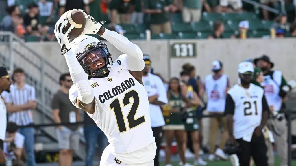 Colorado Buffaloes wide receiver/cornerback Travis Hunter (12) catches a pass during warmups before the football game between Colorado and Colorado State in Fort Collins, CO.