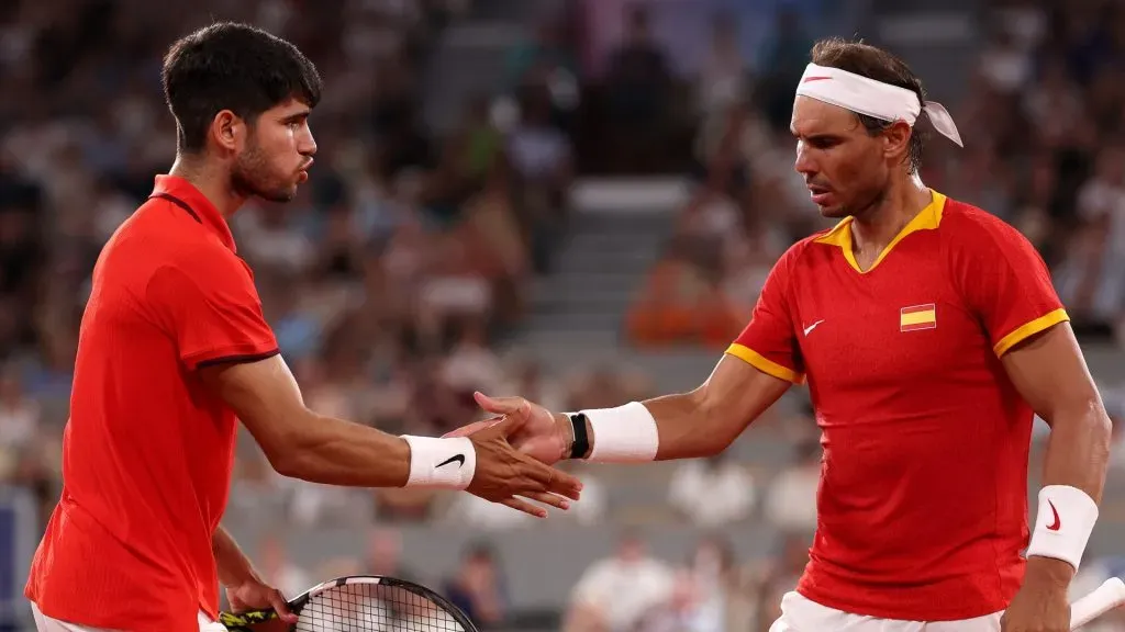 Rafael Nadal of Team Spain (R) and Carlos Alcaraz of Team Spain interact against Austin Krajicek of Team United States and Rajeev Ram of Team United States during the Men's Doubles Quarter-final match on day five of the Olympic Games Paris 2024 at Roland Garros on July 31, 2024 in Paris, France.