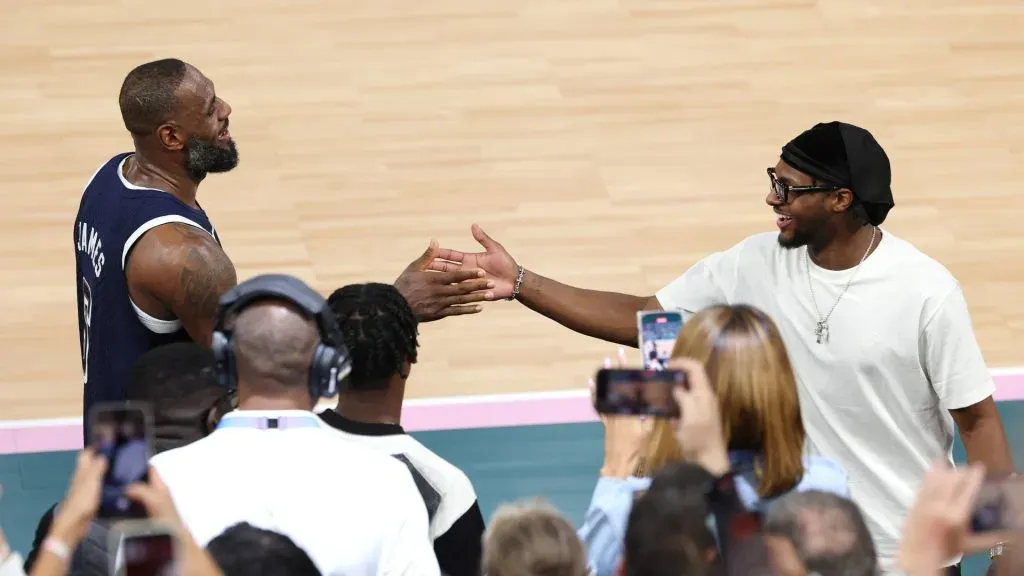 LeBron James #6 of Team United States high fives his son and NBA player Bronny James after Team United Statesā victory against Team France during the Menās Gold Medal game between Team France and Team United States on day fifteen of the Olympic Games Paris 2024 at Bercy Arena on August 10, 2024 in Paris, France. (Photo by Jamie Squire/Getty Images)