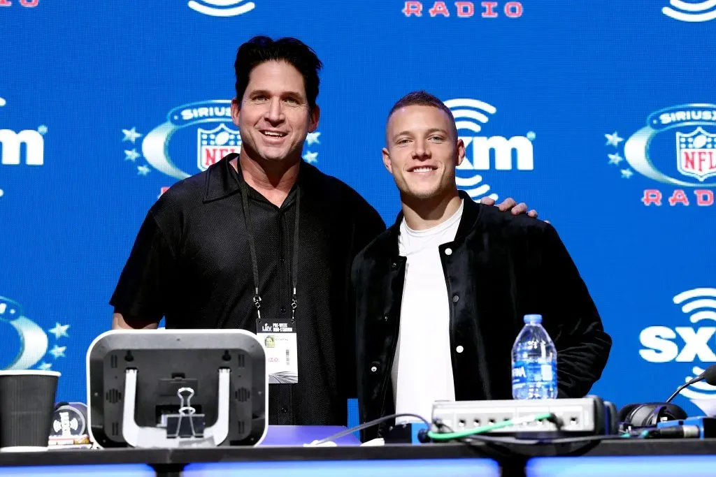 MIAMI, FLORIDA – JANUARY 30: SiriusXM host Ed McCaffrey and NFL running back, Christian McCaffrey of the Carolina Panthers take photos during day 2 of SiriusXM at Super Bowl LIV on January 30, 2020 in Miami, Florida. (Photo by Cindy Ord/Getty Images for SiriusXM )