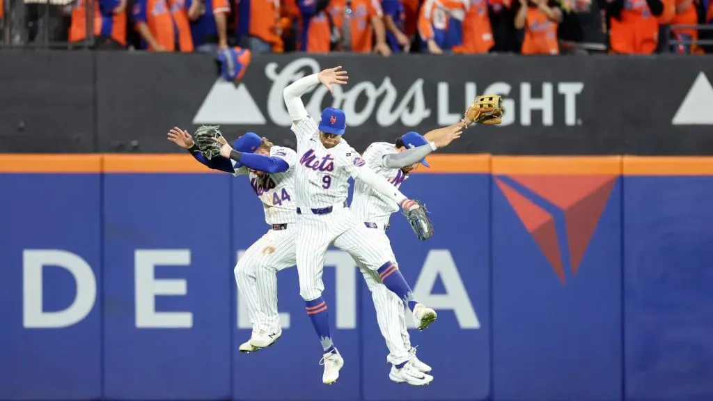 Harrison Bader #44, Brandon Nimmo #9 and Tyrone Taylor #15 of the New York Mets celebrate their 7-2 win against the Philadelphia Phillies in Game Three of the Division Series at Citi Field on October 08, 2024 in New York City. (Photo by Luke Hales/Getty Images)