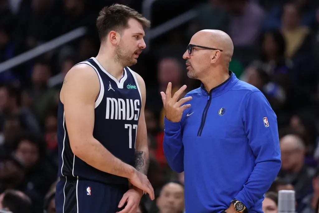 Head coach Jason Kidd (R) talks with his player Luka Doncic #77 of the Dallas Mavericks against the Washington Wizards. Patrick Smith/Getty Images