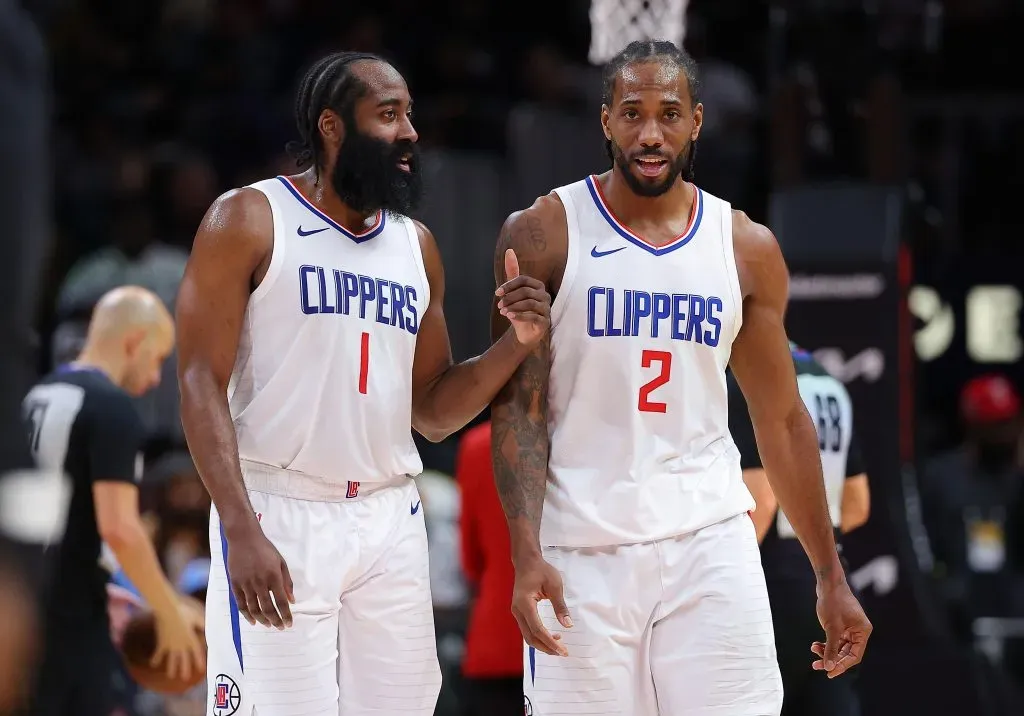 James Harden #1 and Kawhi Leonard #2 of the LA Clippers converse during a timeout in the fourth quarter against the Atlanta Hawks. Kevin C. Cox/Getty Images