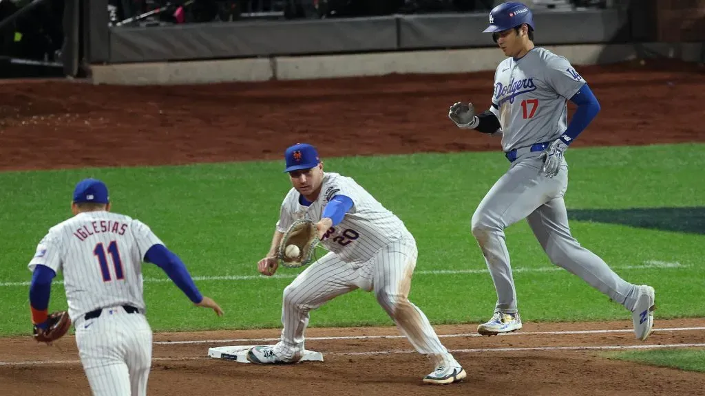 Shohei Ohtani #17 of the Los Angeles Dodgers is forced out by Pete Alonso #20 and Jose Iglesias #11 of the New York Mets seventh inning during Game Four of the National League Championship Series at Citi Field on October 17, 2024 in New York City. (Photo by Al Bello/Getty Images)