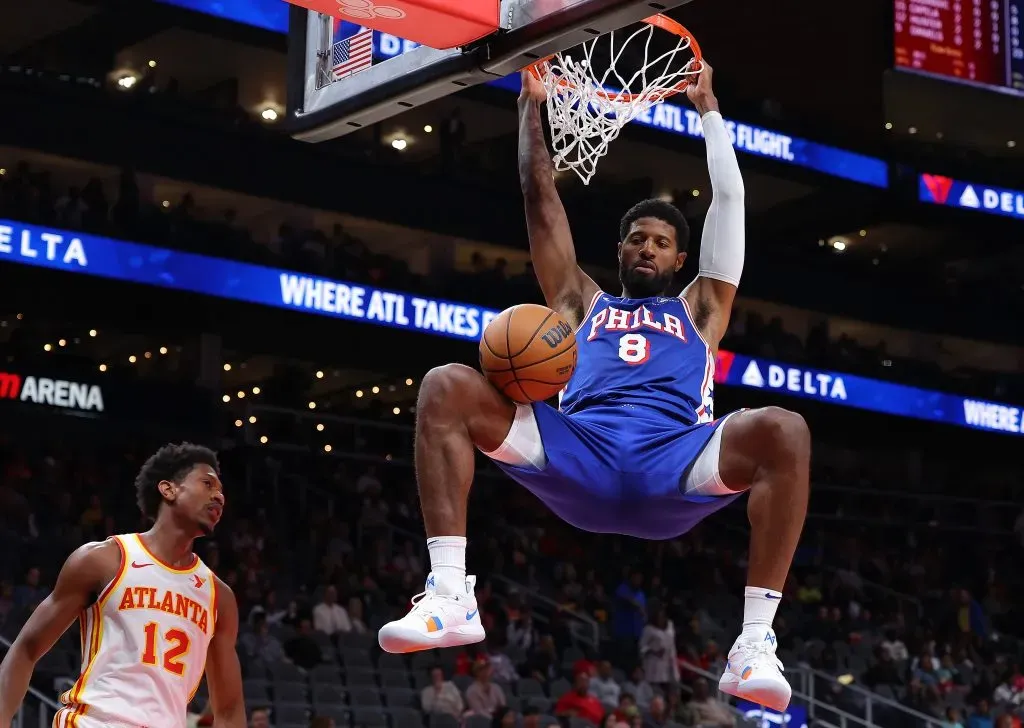 Paul George #8 of the Philadelphia 76ers dunks against DeāAndre Hunter #12 of the Atlanta Hawks during the first quarter at State Farm Arena. Kevin C. Cox/Getty Images