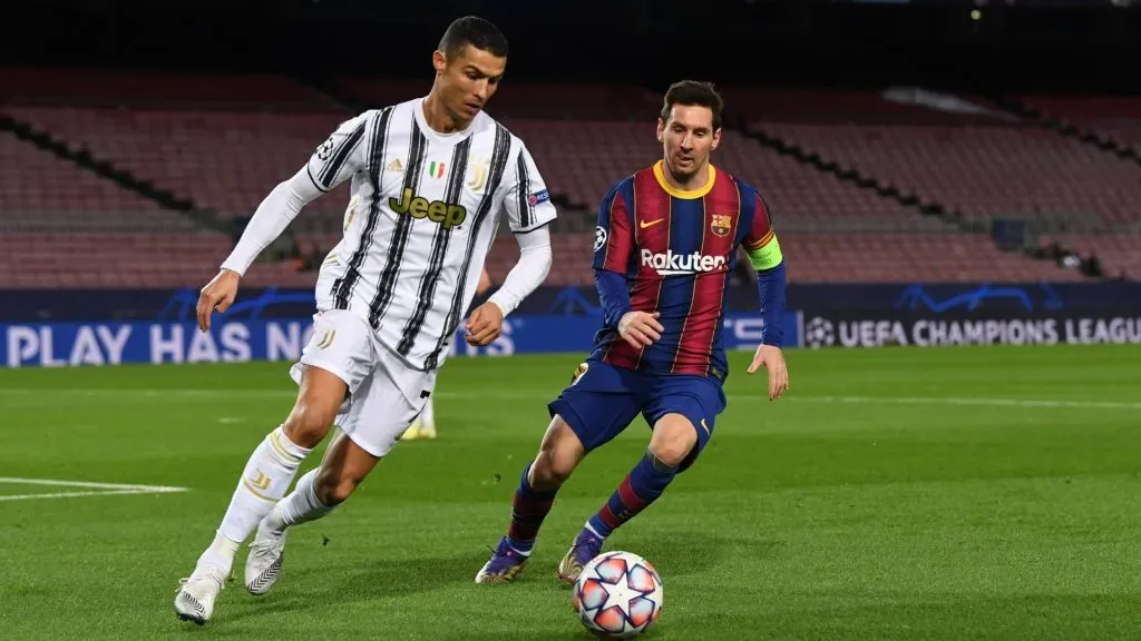 Cristiano Ronaldo of Juventus F.C. is put under pressure by Lionel Messi of Barcelona during the UEFA Champions League Group G stage match between FC Barcelona and Juventus at Camp Nou on December 08, 2020 in Barcelona, Spain.