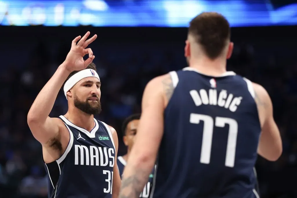 Klay Thompson #31 of the Dallas Mavericks congratulates Luka Doncic #77 on his three-point basket against the San Antonio Spurs. Sam Hodde/Getty Images