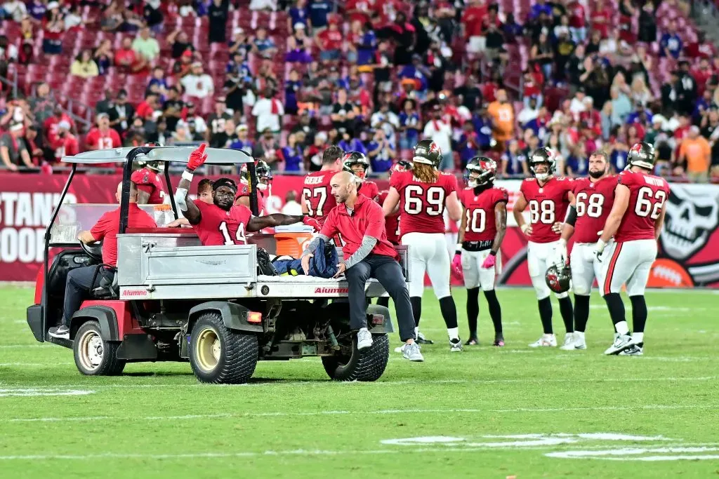 TAMPA, FLORIDA – OCTOBER 21: Chris Godwin #14 of the Tampa Bay Buccaneers reacts as he is carted off the field after being injured during the fourth quarter against the Baltimore Ravens at Raymond James Stadium on October 21, 2024 in Tampa, Florida. Baltimore defeated Tampa Bay 41-31. (Photo by Julio Aguilar/Getty Images)