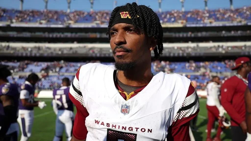 Jayden Daniels #5 of the Washington Commanders walks off the field after their 23-30 loss to the Baltimore Ravens at M&T Bank Stadium on October 13, 2024. (Source: Patrick Smith/Getty Images)