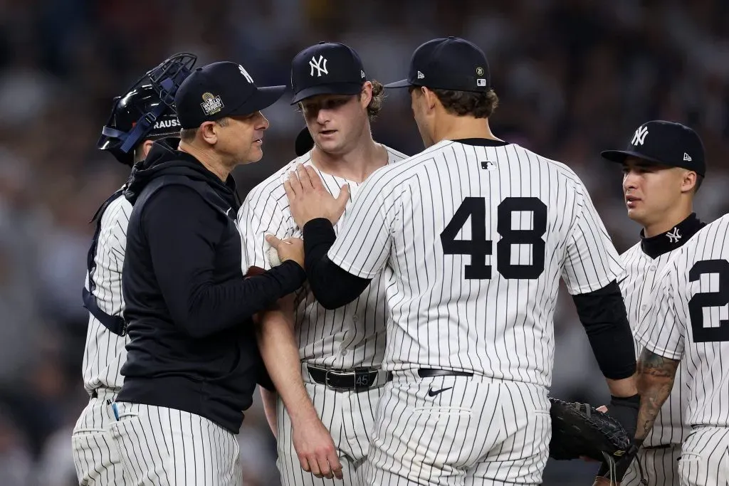 Manager Aaron Boone #17 of the New York Yankees relieves starting pitcher Gerrit Cole #45