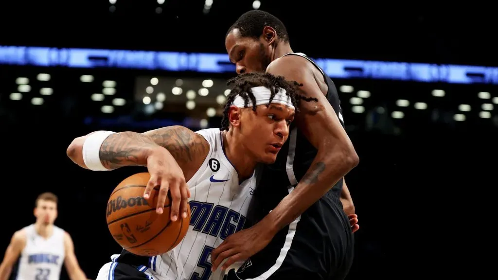 Paolo Banchero #5 of the Orlando Magic goes to the net against Kevin Durant #7 of the Brooklyn Nets during the second half at Barclays Center on November 28, 2022 in New York City.
