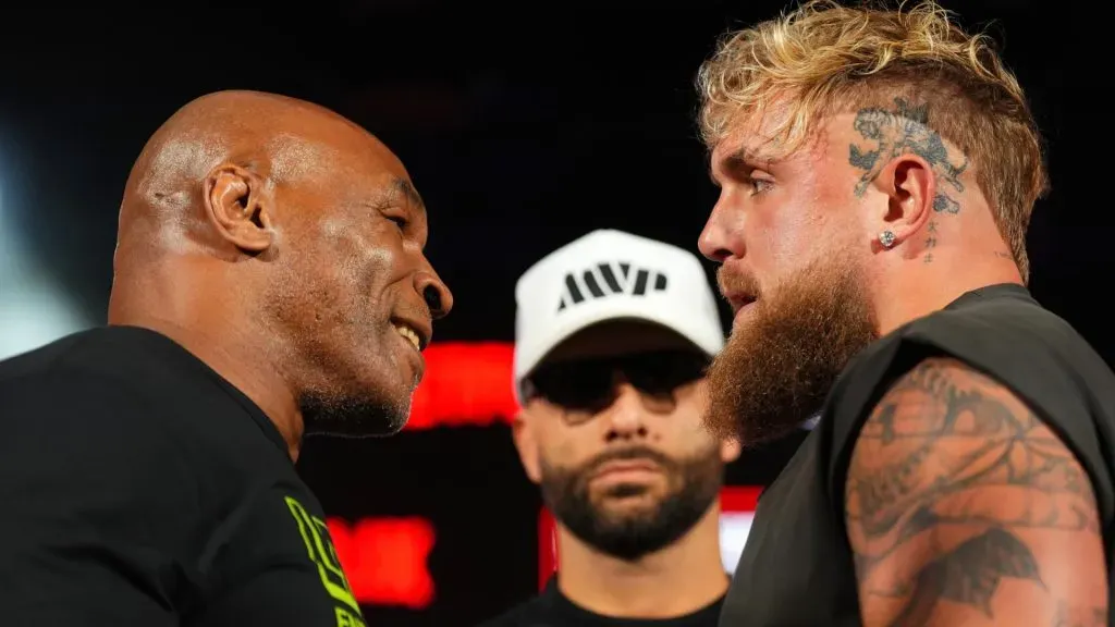 (L-R) Mike Tyson, Nakisa Bidarian and Jake Paul pose onstage during the Jake Paul vs. Mike Tyson Boxing match Arlington press conference at Texas Live! on May 16, 2024 in Arlington, Texas. (Photo by Cooper Neill/Getty Images for Netflix)