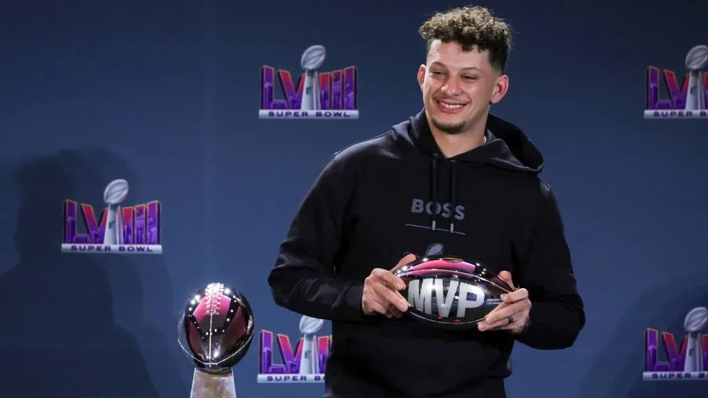 Patrick Mahomes #15 of the Kansas City Chiefs poses with the MVP award during a news conference for the winning head coach and MVP of Super Bowl LVIII in 2024. (Source: Ethan Miller/Getty Images)