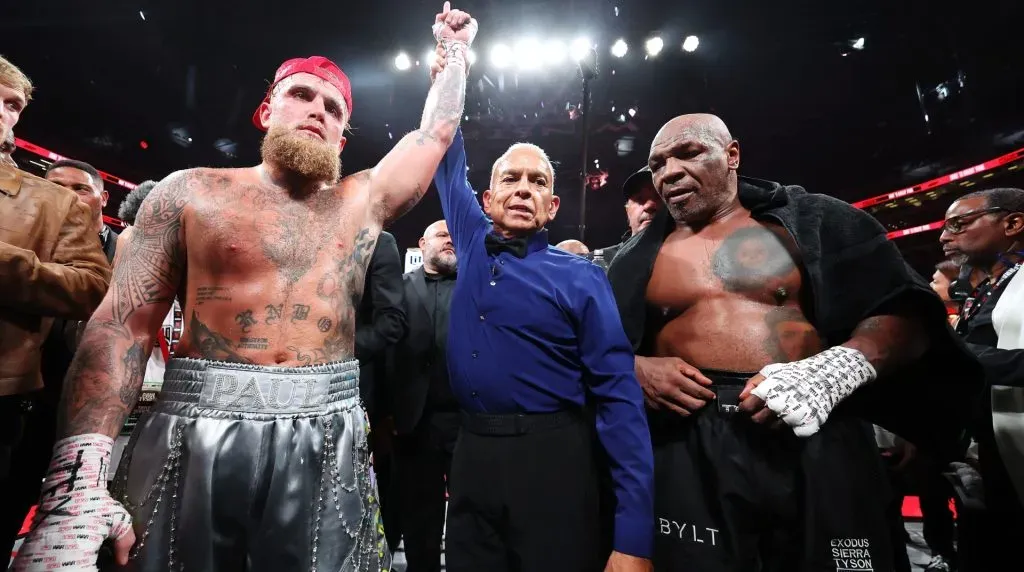 L-R) Jake Paul announced as winner against Mike Tyson during LIVE On Netflix: Jake Paul vs. Mike Tyson at AT&T Stadium on November 15, 2024 in Arlington, Texas. (Photo by Al Bello/Getty Images for Netflix © 2024)