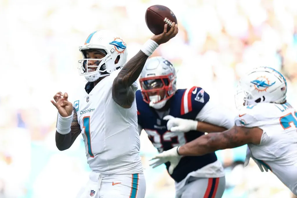 Tua Tagovailoa #1 of the Miami Dolphins throws a pass against the New England Patriots